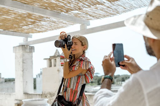 Behind the scenes of a photographer photographing a destination wedding