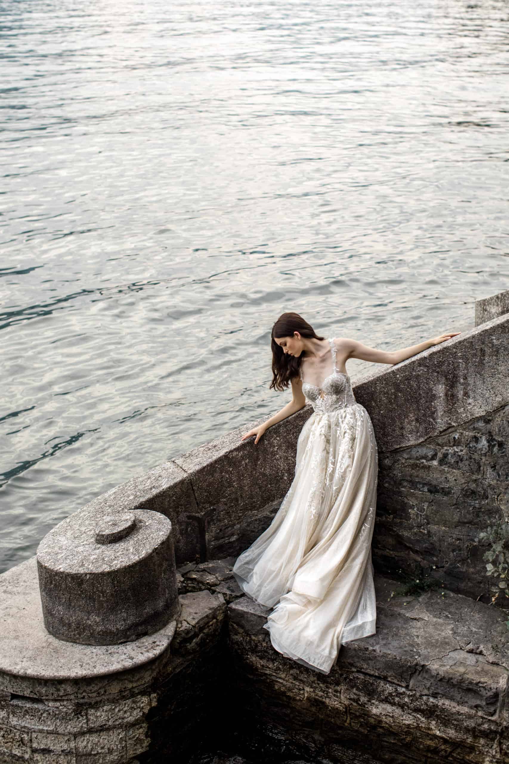 Model wears bridal gown during Lake Como styled shoot