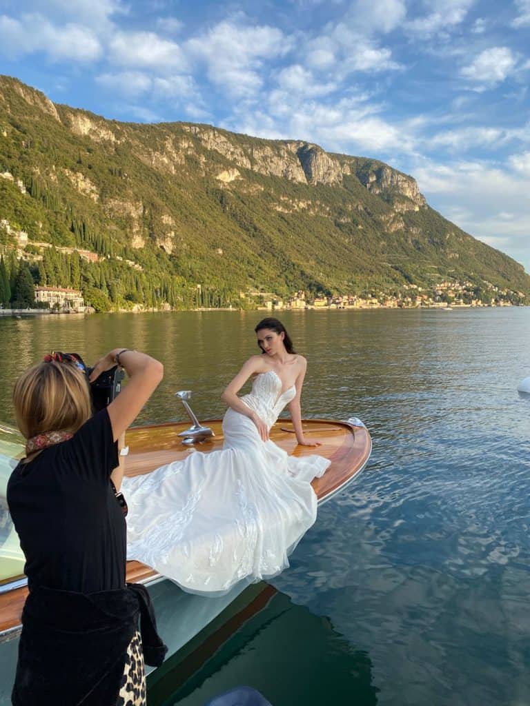 Photographer and model during  editorial session in Lake Como, Italy