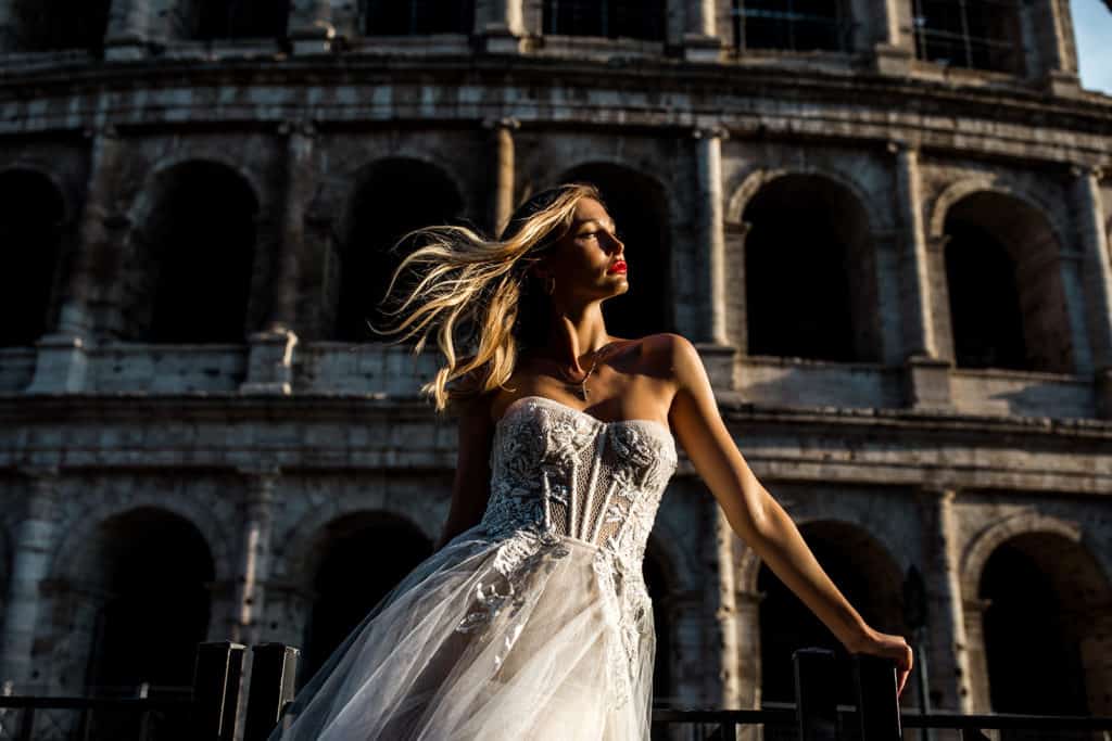 Lilly Red Photography captured bridal model in front of coliseum in Rome during wedding styled shoot