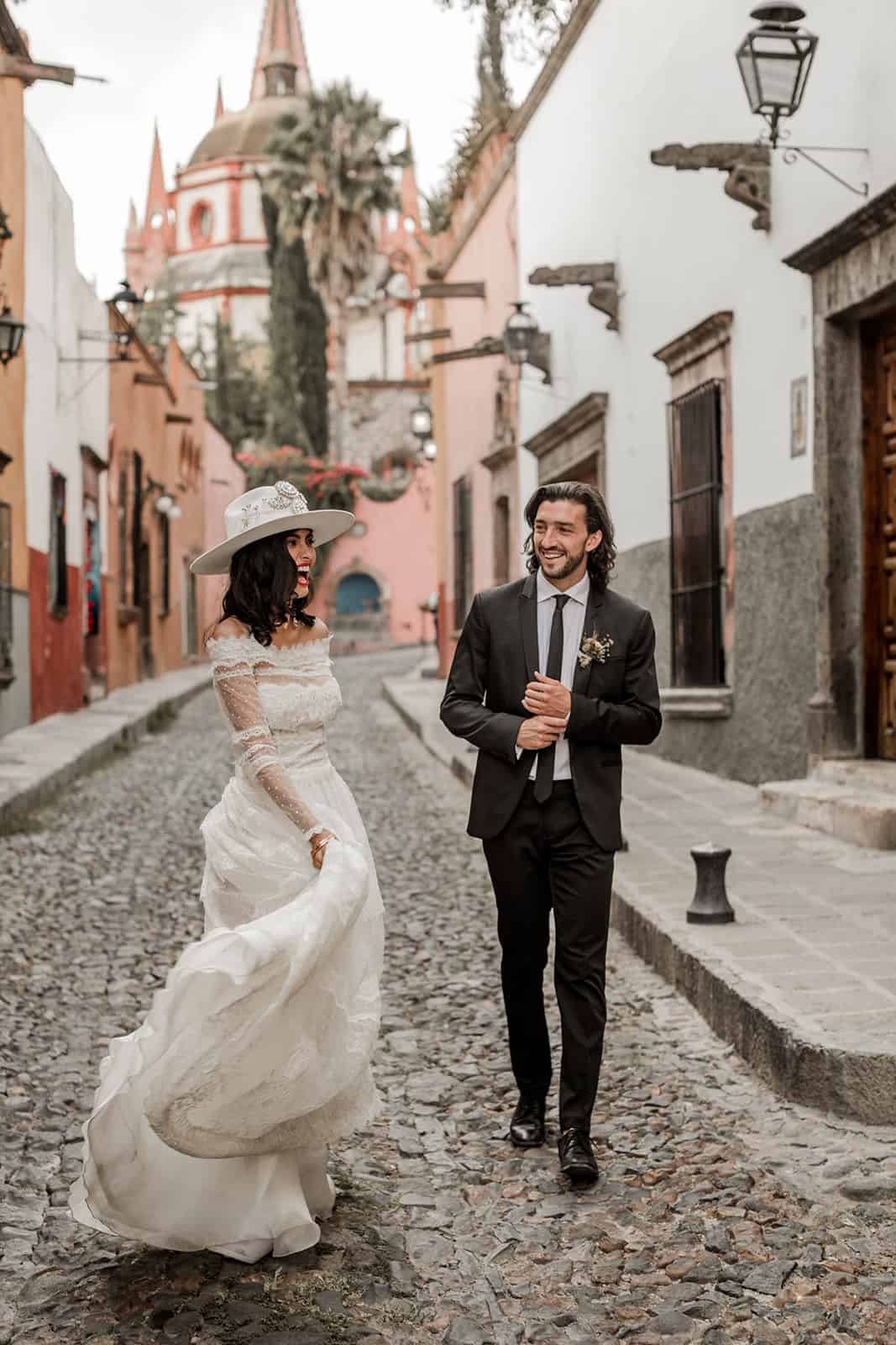 Bride and groom model walk streets of San Miguel de Allende during wedding styled shoot