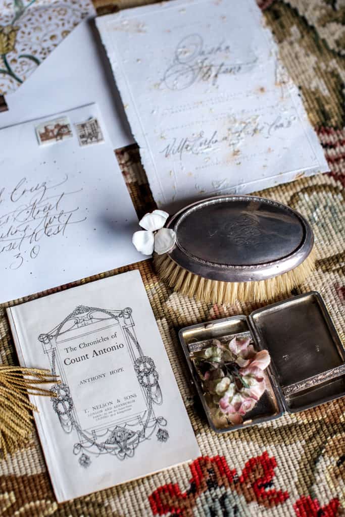 Vow renewal invitation details with antique items