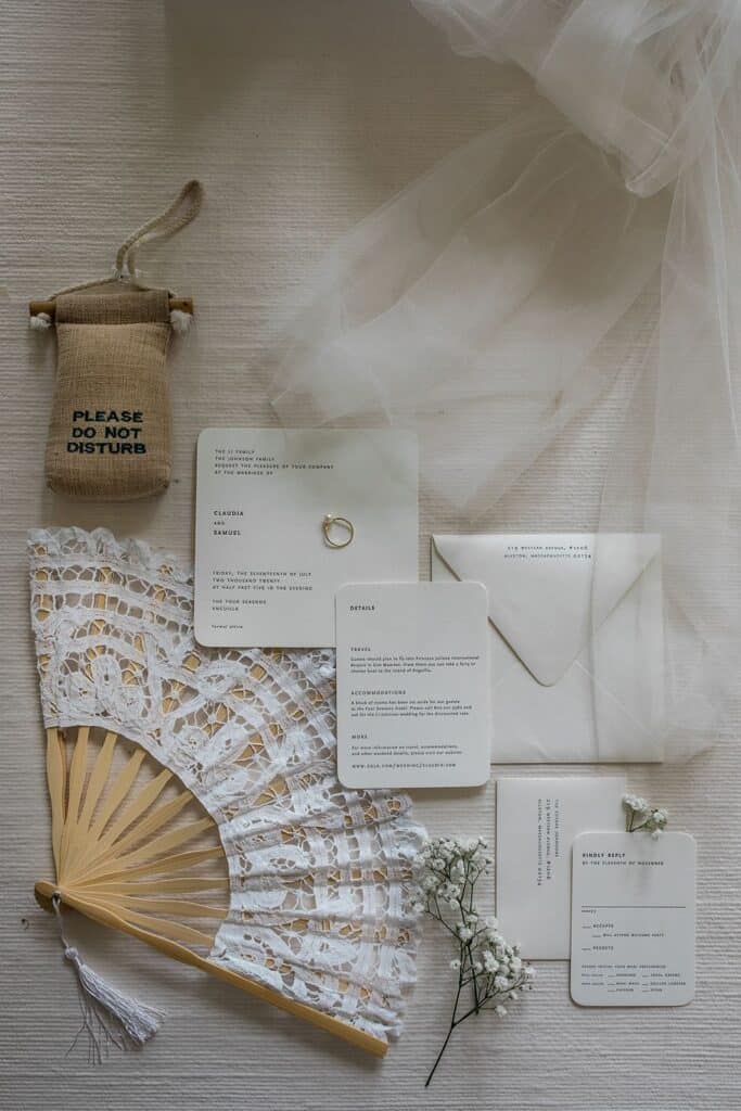 Cream and tan wedding invitation flat lay photography