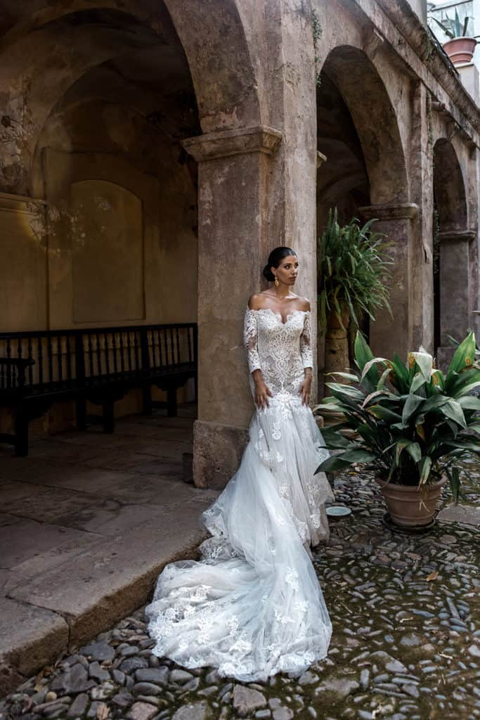 Bride stands for bridal portrait at Villa D'Orri in Sardinia Italy