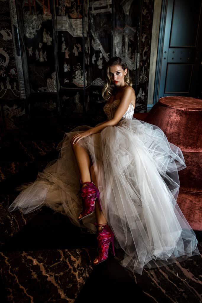 Bride wearing Berta wedding dress and merlot colored heels showcases photographer's unique, dramatic style which the best wedding blogs want to see