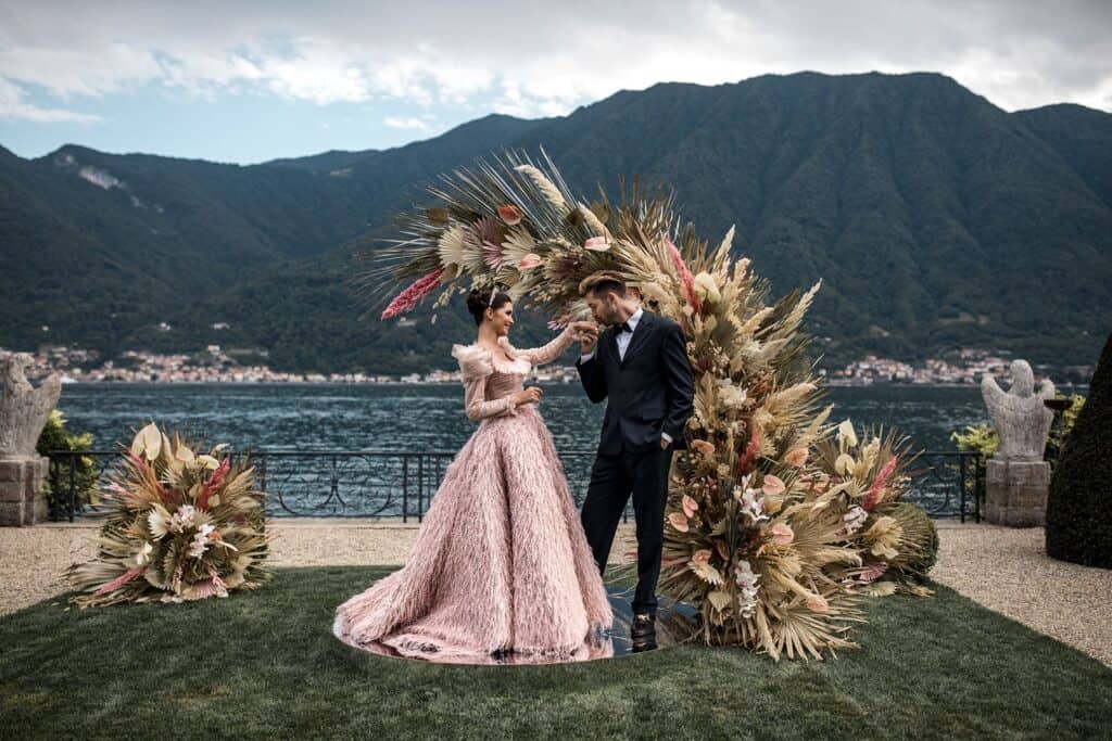Couple during elopement wedding ceremony in Lake Como, taken by photographer who focuses solely on weddings after learning how to outsource for photographers