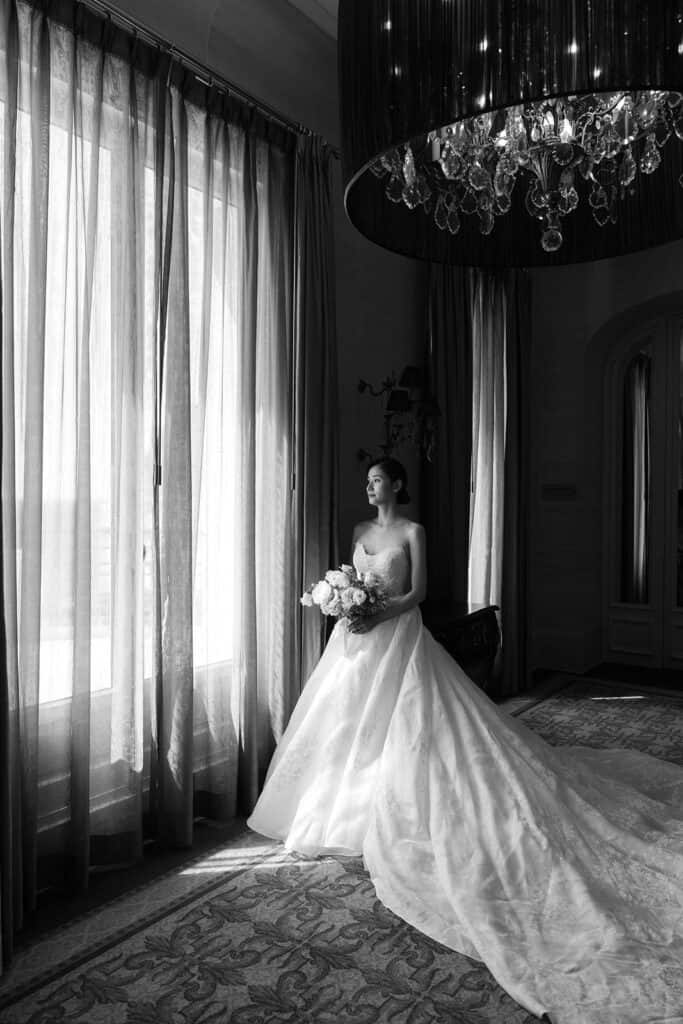 Black and white bridal portrait taken by photographer who can focus on her couples because she learned how to outsource for photographers