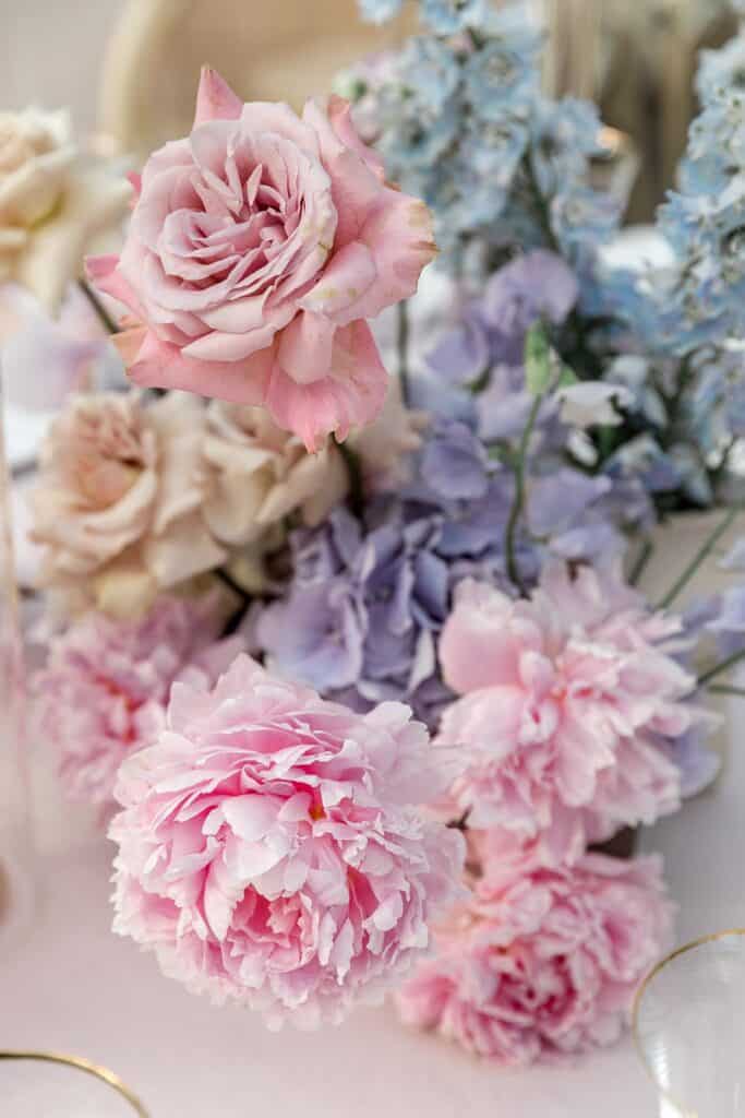 Pink peonies and blue and purple hydrangeas for wedding flower arrangements
